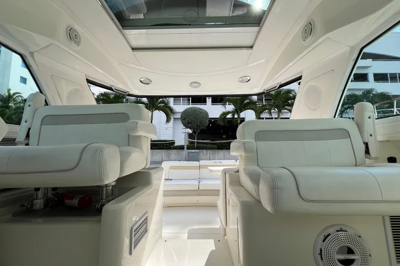 Slide: The Image of Interior view of 2010 Sea Ray 450 Sundancer yacht with white seating and modern design. - 10