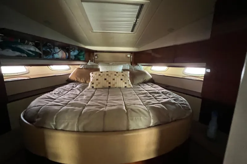 Slide: The Image of Luxurious cabin interior of 2010 Sea Ray 450 Sundancer yacht with cozy bed. - 18