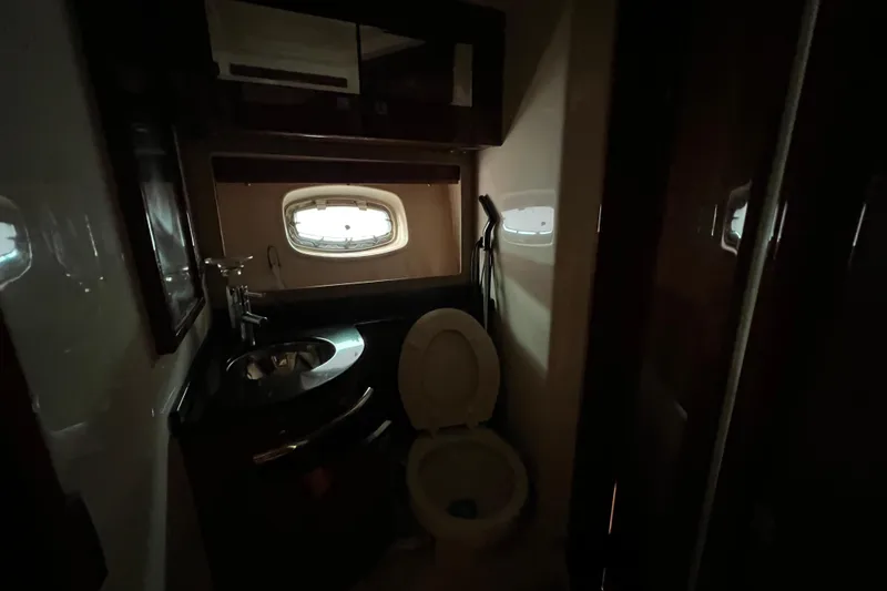 Slide: The Image of Bathroom interior of 2010 Sea Ray 450 Sundancer yacht with sink and toilet. - 20