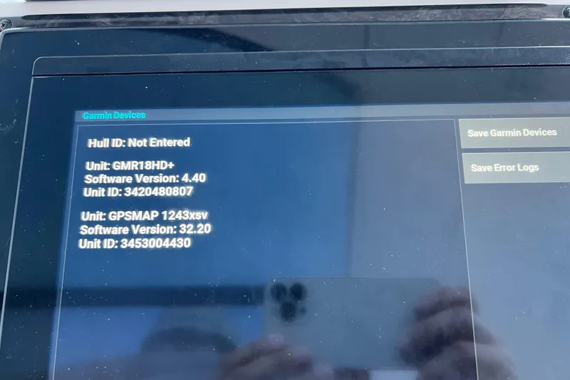 Slide: The Image of Garmin device screen on 2010 Sea Ray 450 Sundancer, showing software versions and unit IDs. - 21