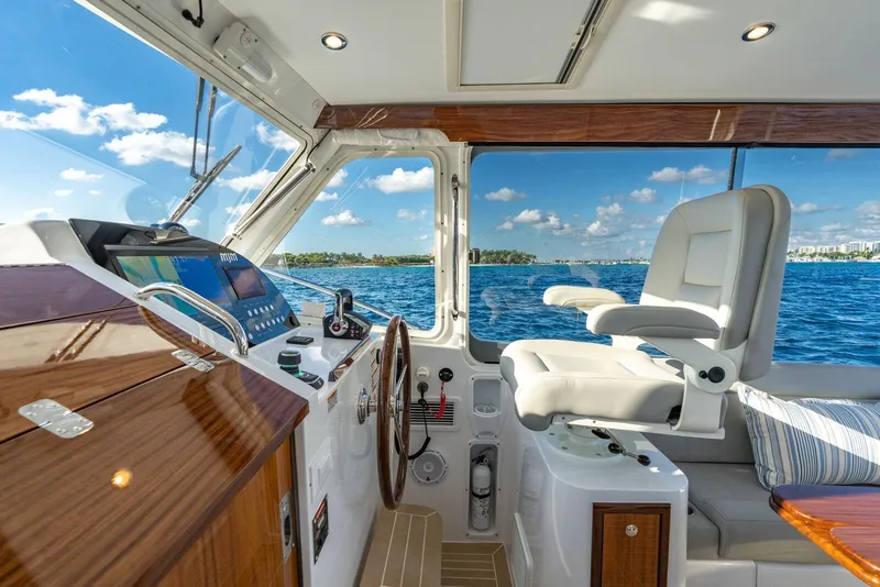 Slide: The Image of Interior view of 2026 MJM 38RS yacht cockpit with ocean backdrop. - 8