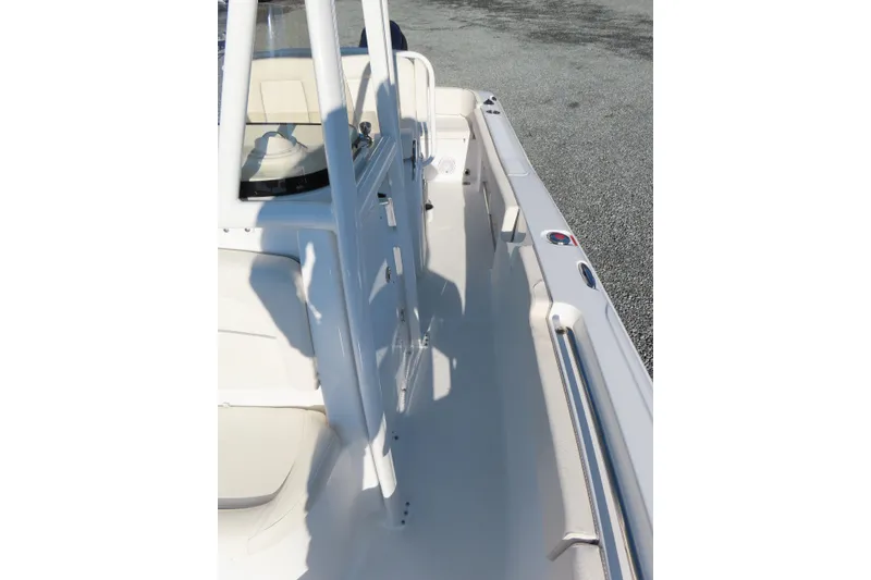 Slide: The Image of 2023 Sea Hunt Ultra 234 boat interior with seating and console view. - 16