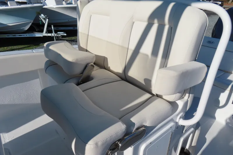 Slide: The Image of 2023 Sea Hunt Ultra 234 boat seat with armrests, showcasing comfortable design. - 23