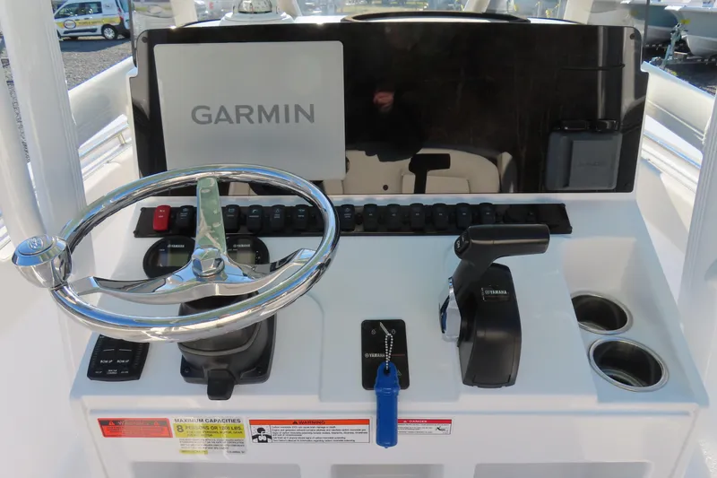 Slide: The Image of 2023 Sea Hunt Ultra 234 helm with Garmin display and Yamaha controls. - 24