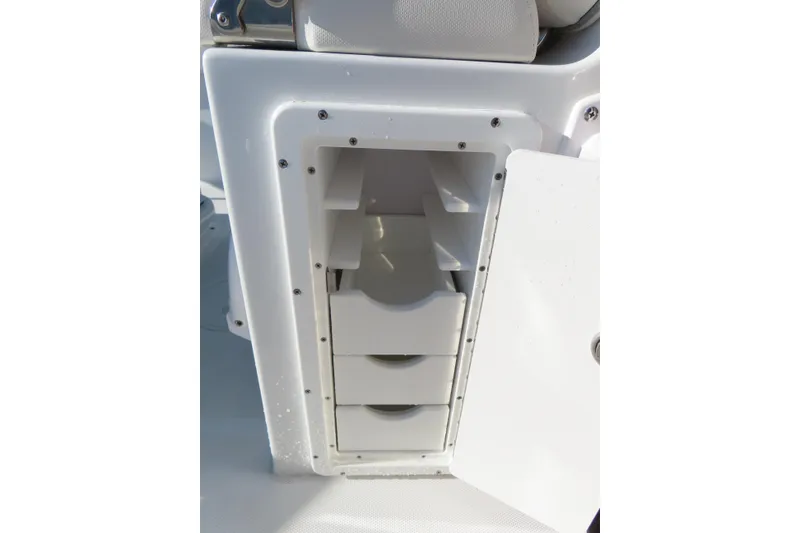 Slide: The Image of Storage compartment on a 2023 Sea Hunt Ultra 234 boat, featuring multiple shelves. - 36