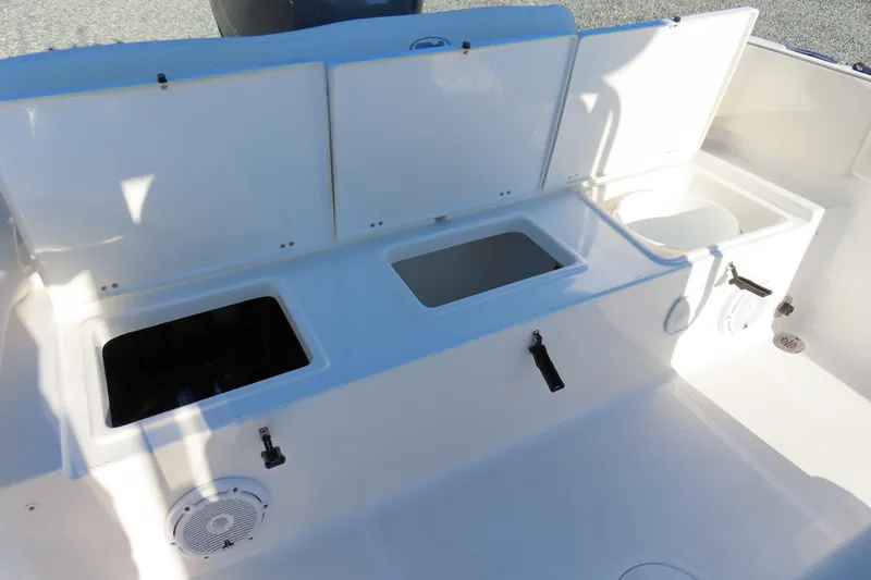 Slide: The Image of 2023 Sea Hunt Ultra 234 boat storage compartments and seating area. - 39