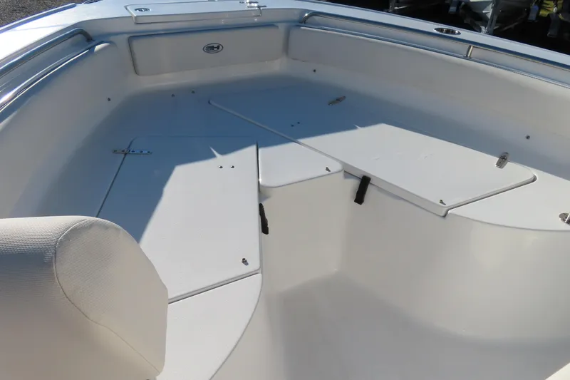 Slide: The Image of 2023 Sea Hunt Ultra 234 boat interior with seating and storage compartments. - 8