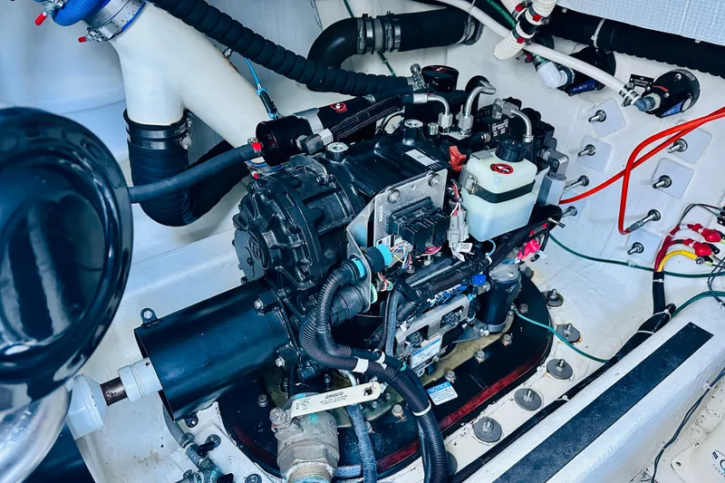 Slide: The Image of Engine compartment of a 2013 Sabre 48 Salon Express yacht, showcasing mechanical components. - 17