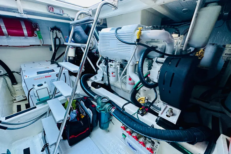 Slide: The Image of Engine room of 2013 Sabre 48 Salon Express with Cummins Onan generator and equipment. - 18