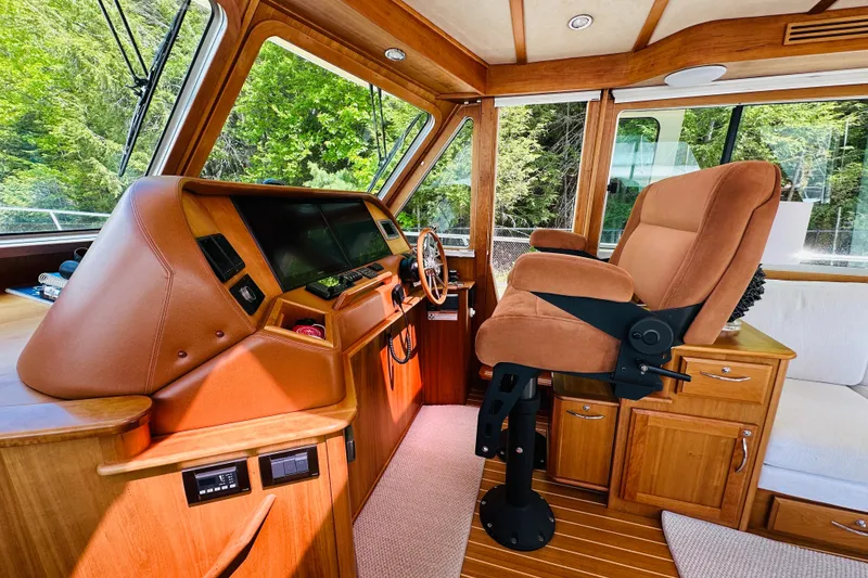 Slide: The Image of Interior of 2013 Sabre 48 Salon Express yacht with helm and captain's chair. - 5