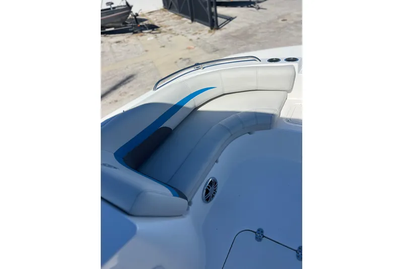 Slide: The Image of 2021 Hurricane SunDeck Sport 188 OB boat interior with cushioned seating and cup holders. - 11