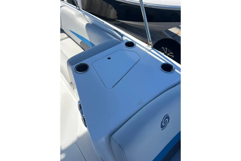 Slide: The Image of 2021 Hurricane SunDeck Sport 188 OB boat interior with cup holders and sleek design. - 12