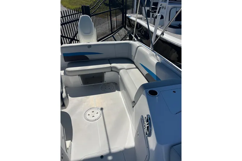Slide: The Image of 2021 Hurricane SunDeck Sport 188 OB boat interior with seating and cup holders. - 16