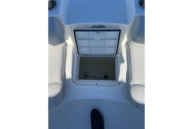 Slide: The Image of 2021 Hurricane SunDeck Sport 188 OB boat storage compartment with open hatch. - 17