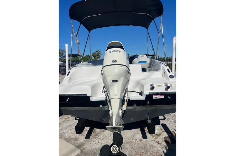 Slide: The Image of 2021 Hurricane SunDeck Sport 188 OB boat with outboard motor and canopy, rear view. - 3