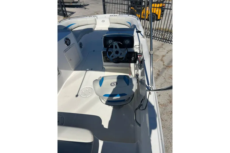 Slide: The Image of 2021 Hurricane SunDeck Sport 188 OB boat interior with steering console and seating. - 4