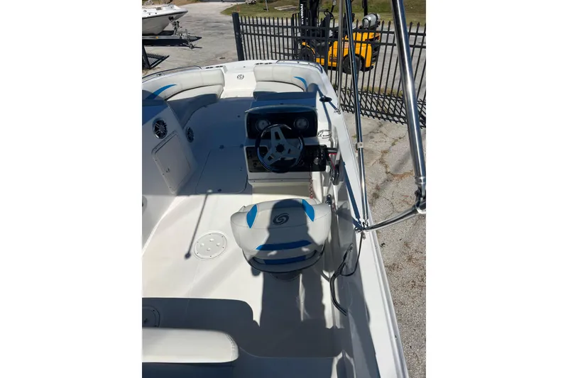 Slide: The Image of 2021 Hurricane SunDeck Sport 188 OB boat interior with steering console and seating. - 8