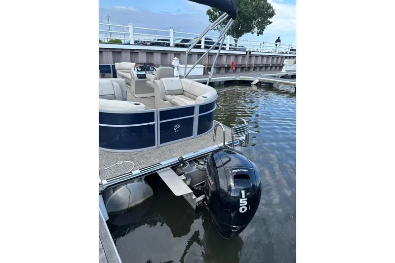 Slide: The Image of 2023 Cypress Cay Seabreeze 232 pontoon boat docked with Mercury 150 outboard motor. - 9
