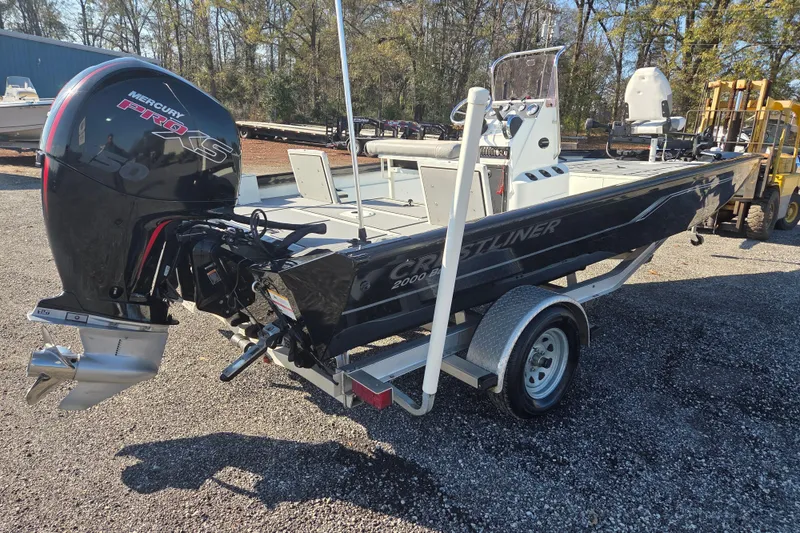Slide: The Image of 2020 Crestliner 2000 Bay boat with Mercury Pro XS engine on trailer. - 4