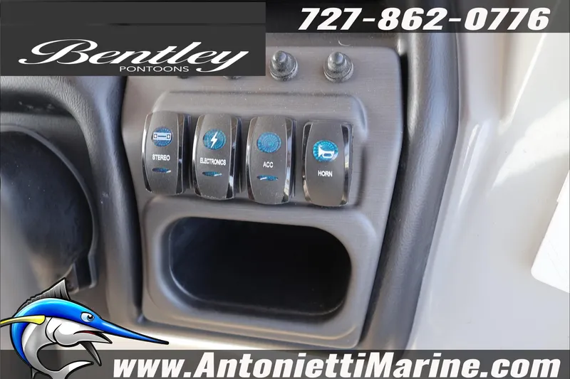 Slide: The Image of Control panel of 2026 Bentley Pontoons 243 Fish-N-Cruise with switches and logo. - 23