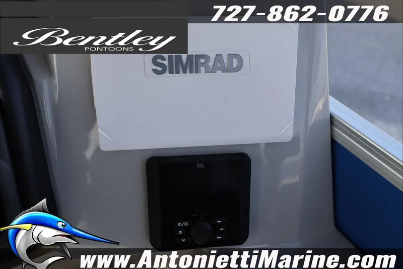 Slide: The Image of 2026 Bentley Pontoons 243 Fish-N-Cruise dashboard with Simrad and JBL systems. - 24