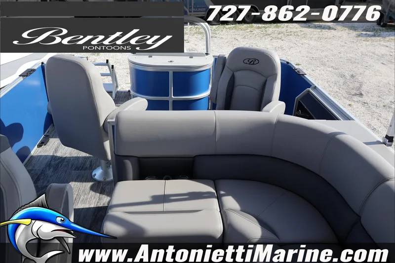 Slide: The Image of 2026 Bentley Pontoons 243 Fish-N-Cruise interior with gray seating, blue accents, and marine branding. - 26