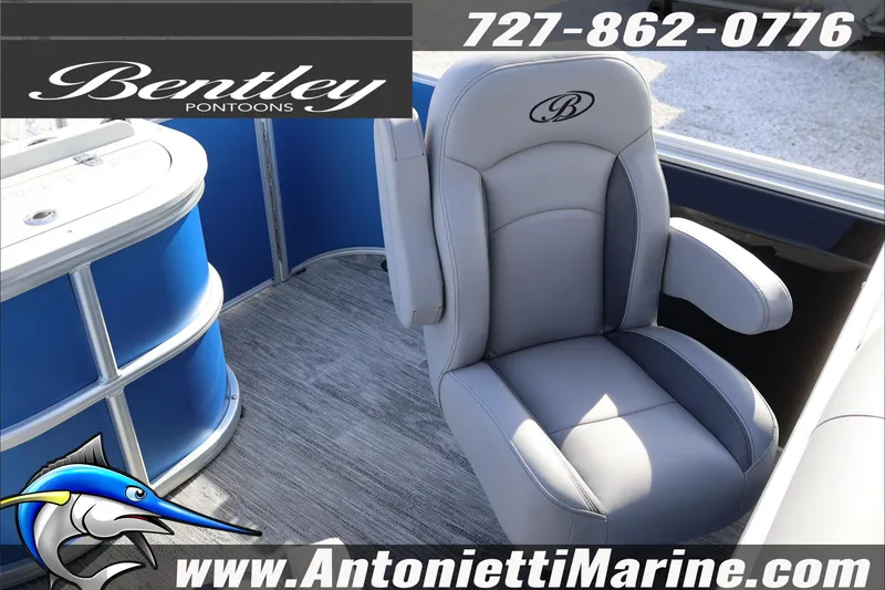 Slide: The Image of 2026 Bentley Pontoons 243 Fish-N-Cruise boat interior with gray captain's chair. - 27