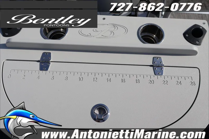 Slide: The Image of Bentley Pontoons 243 Fish-N-Cruise 2026 with measurement board and cup holders. - 33