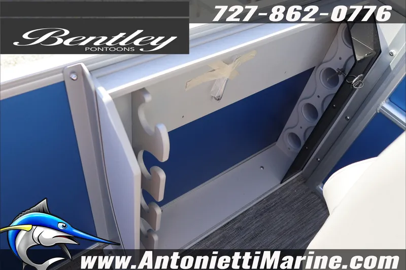 Slide: The Image of 2026 Bentley Pontoons 243 Fish-N-Cruise interior with rod holders and cup holders. - 36