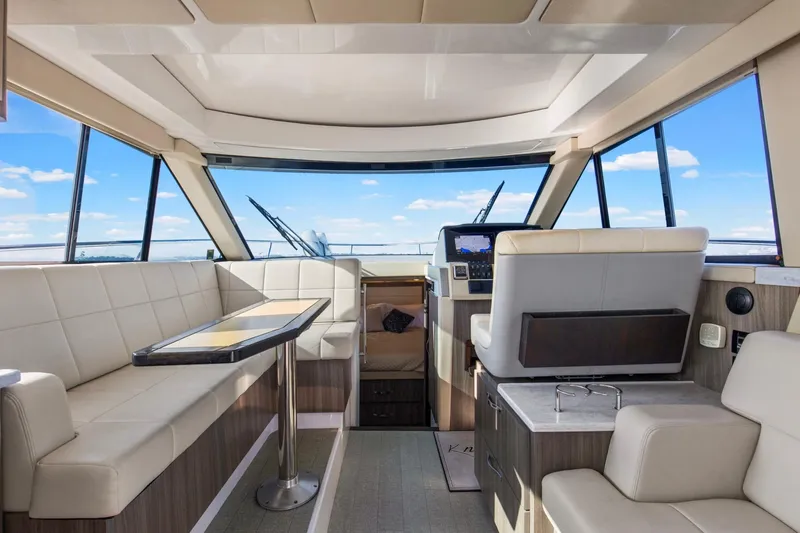 Slide: The Image of Luxurious interior of 2020 Regal 38 XO yacht with modern seating and navigation area. - 13