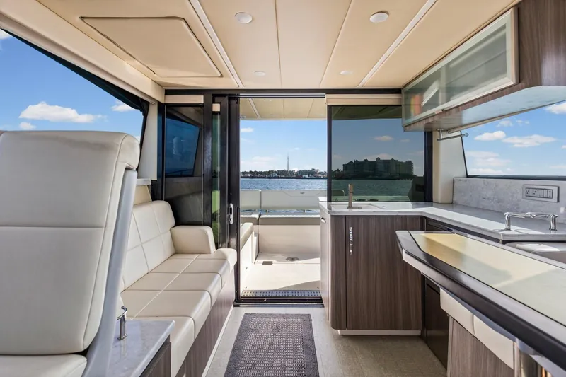 Slide: The Image of Luxurious interior of 2020 Regal 38 XO yacht with modern kitchen and scenic water view. - 17