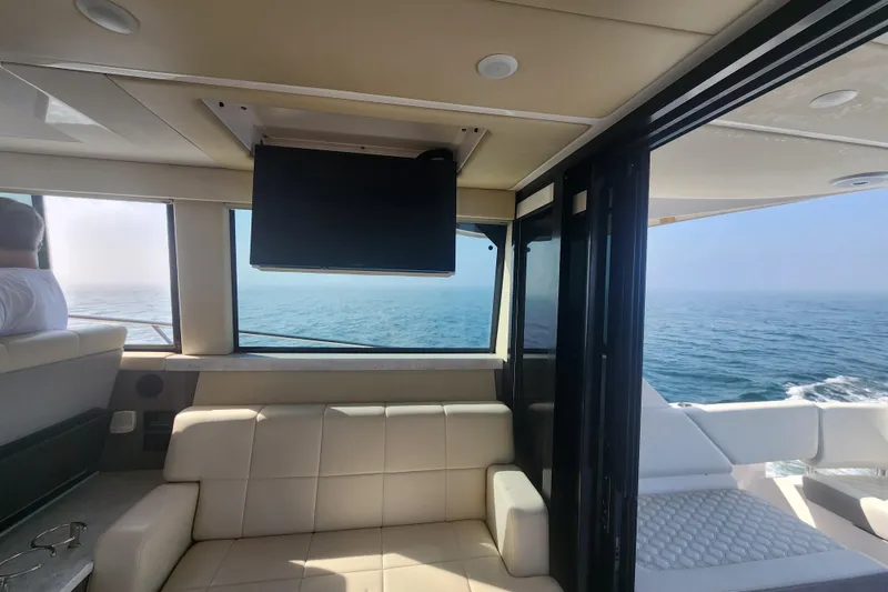 Slide: The Image of Interior of 2020 Regal 38 XO yacht with ocean view and seating area. - 20