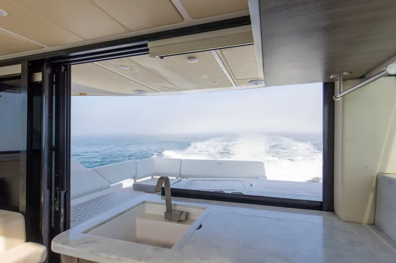 Slide: The Image of Interior view of 2020 Regal 38 XO yacht with ocean backdrop. - 23