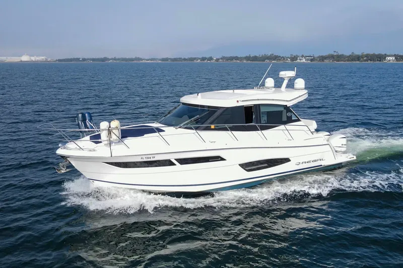 Slide: The Image of 2020 Regal 38 XO yacht cruising on open water. - 3