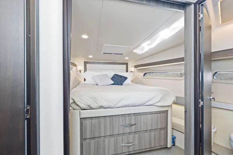 Slide: The Image of Luxurious cabin interior of 2020 Regal 38 XO yacht with cozy bed and modern design. - 30
