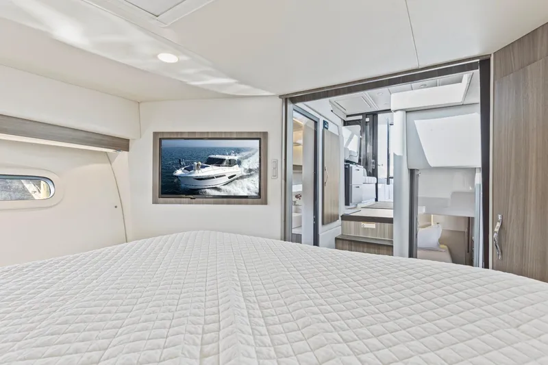 Slide: The Image of Luxurious interior of 2020 Regal 38 XO yacht with modern design and comfortable bedding. - 32