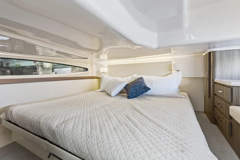Slide: The Image of Luxurious cabin interior of 2020 Regal 38 XO yacht with cozy bed and modern design. - 34