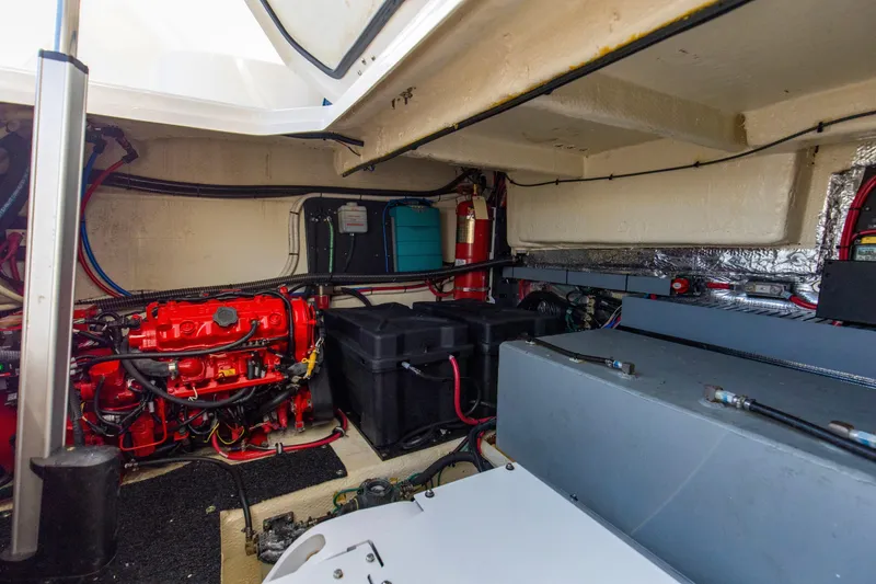 Slide: The Image of Engine room of 2020 Regal 38 XO boat with visible red engine components. - 42