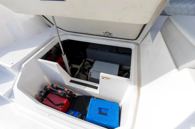 Slide: The Image of Open engine compartment of 2020 Regal 38 XO boat, showcasing storage and equipment. - 43