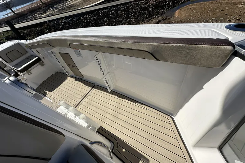 Slide: The Image of 2023 Yamaha Boats 252 FSH Sport interior with sleek seating and modern design. - 23