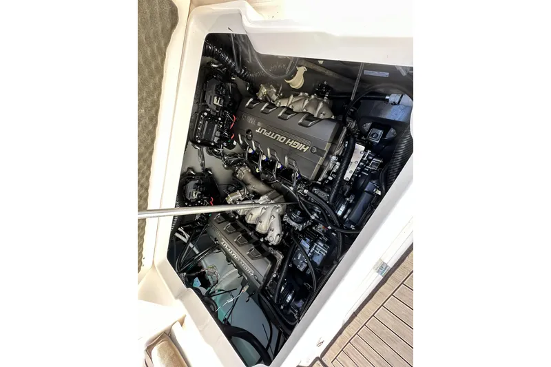 Slide: The Image of Engine compartment of 2023 Yamaha Boats 252 FSH Sport, showcasing high output engine components. - 24