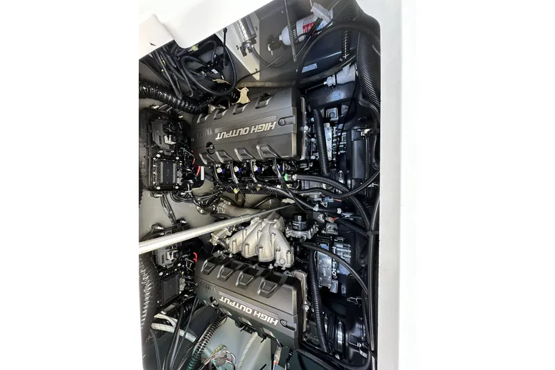 Slide: The Image of Engine compartment of 2023 Yamaha Boats 252 FSH Sport, showcasing dual high-output engines. - 25