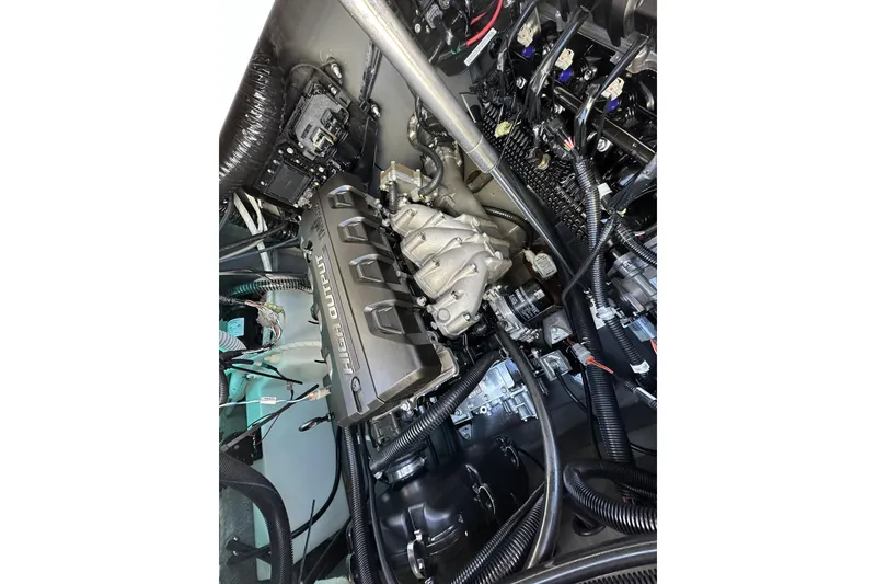Slide: The Image of Engine compartment of 2023 Yamaha Boats 252 FSH Sport, showcasing high output components. - 26