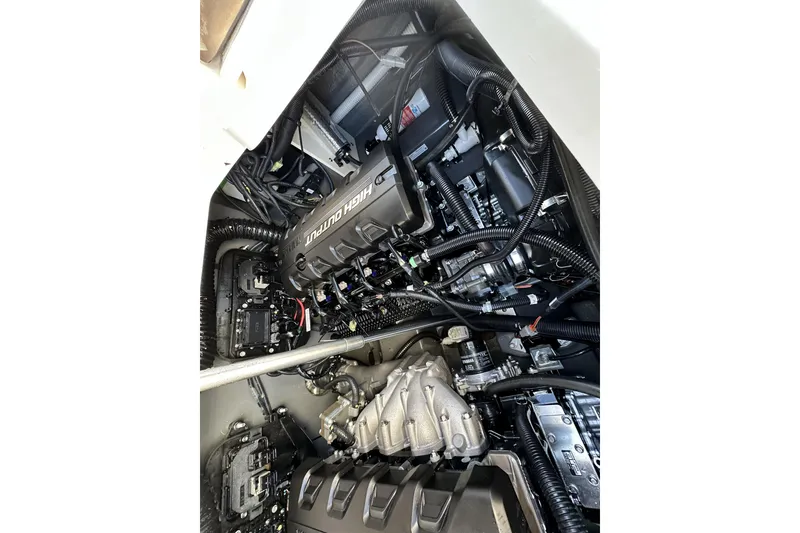 Slide: The Image of Engine compartment of 2023 Yamaha Boats 252 FSH Sport, showcasing high-output components. - 27