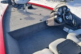 Slide: The Image of 2018 Tracker Pro Team 175 TXW boat interior with steering console and seating. - 8
