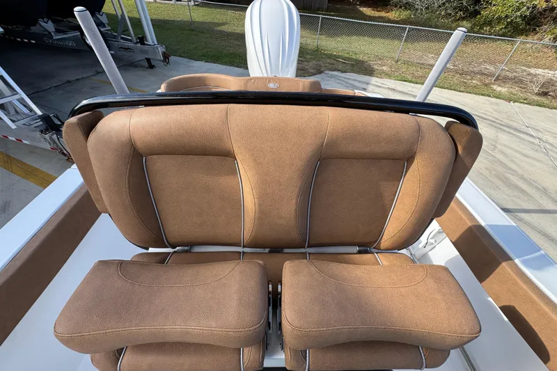 Slide: The Image of 2024 Sea Hunt Ultra 239 SE boat seats with tan upholstery and sleek design. - 25