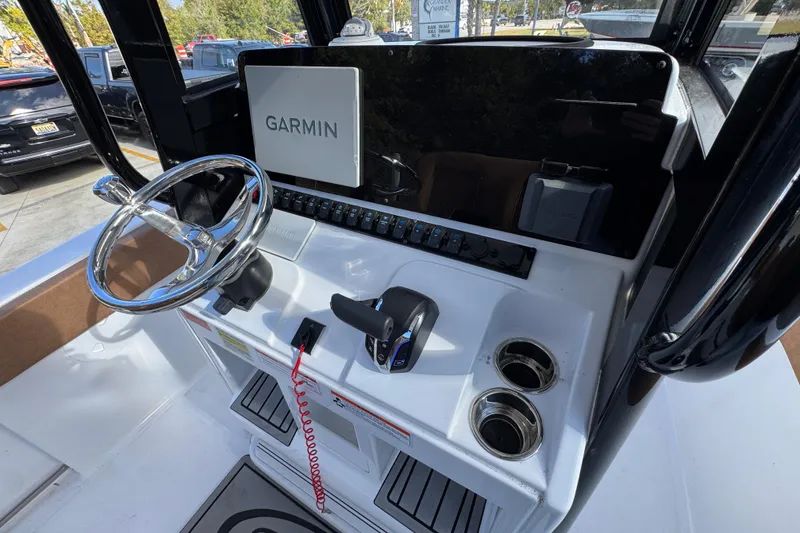 Slide: The Image of 2024 Sea Hunt Ultra 239 SE boat console with Garmin navigation system. - 30