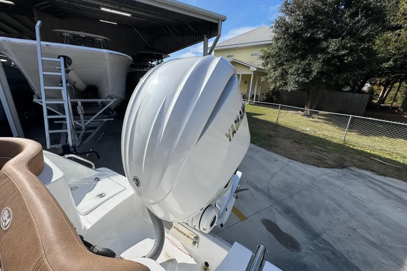 Slide: The Image of 2024 Sea Hunt Ultra 239 SE boat with Yamaha outboard engine in driveway. - 38