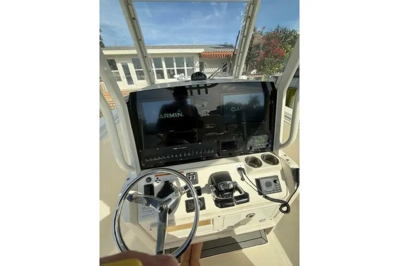 Slide: The Image of 2020 Cobia 280 Center Console boat dashboard with Garmin navigation system. - 6