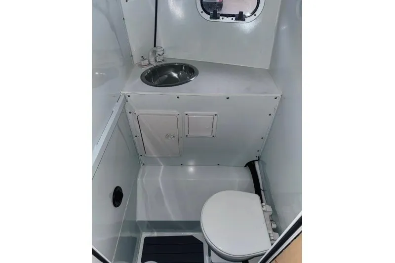 Slide: The Image of 2026 Hewescraft 290 Adventure boat bathroom with sink and toilet. - 14